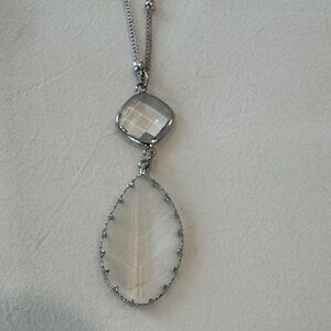 17”
Clear and Silver Pendant Necklace with silver colored beads along chain.